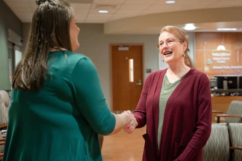 Photos of Dr. Sahni patient Kim and team performing orthopedic shoulder nurse navigator meet for infusion at WellSpan Adams Cancer Center. For use in Macroscope Magazine #3.