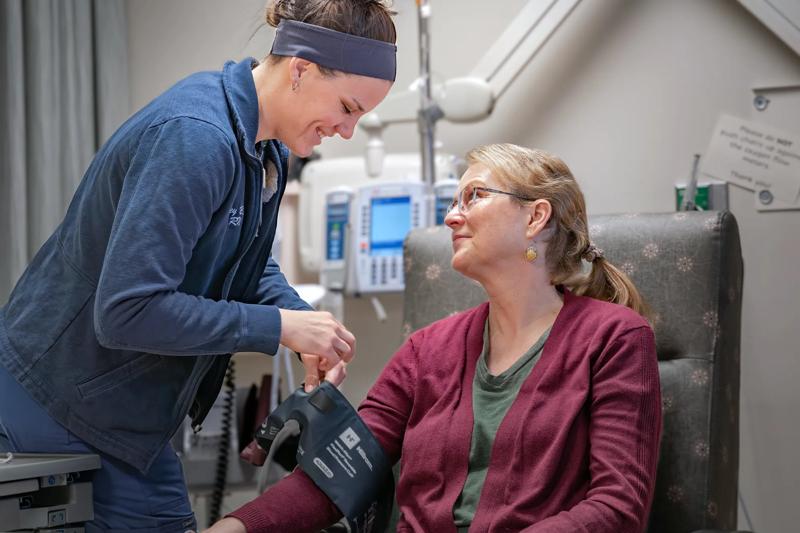 Photos of Dr. Sahni patient Kim and team performing orthopedic shoulder nurse navigator meet for infusion at WellSpan Adams Cancer Center. For use in Macroscope Magazine #3.